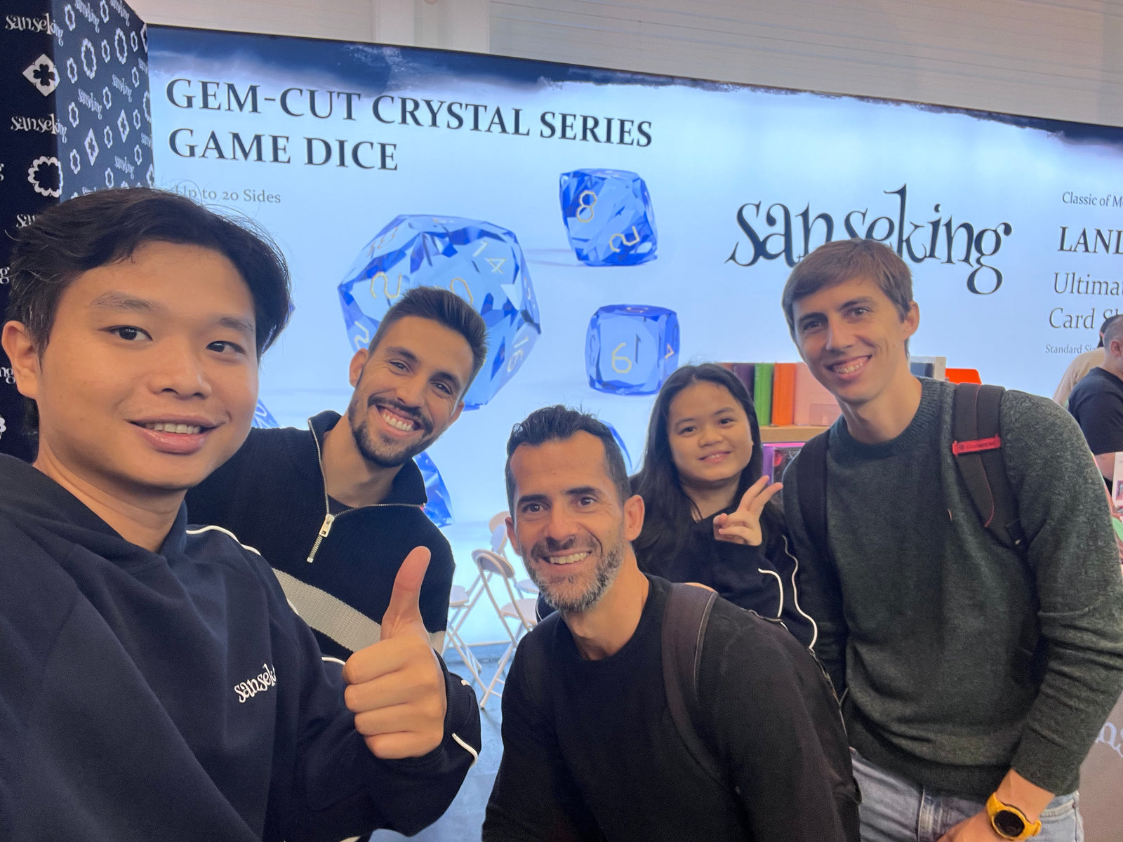Customers and the Sanseking team meeting at a card game exhibition