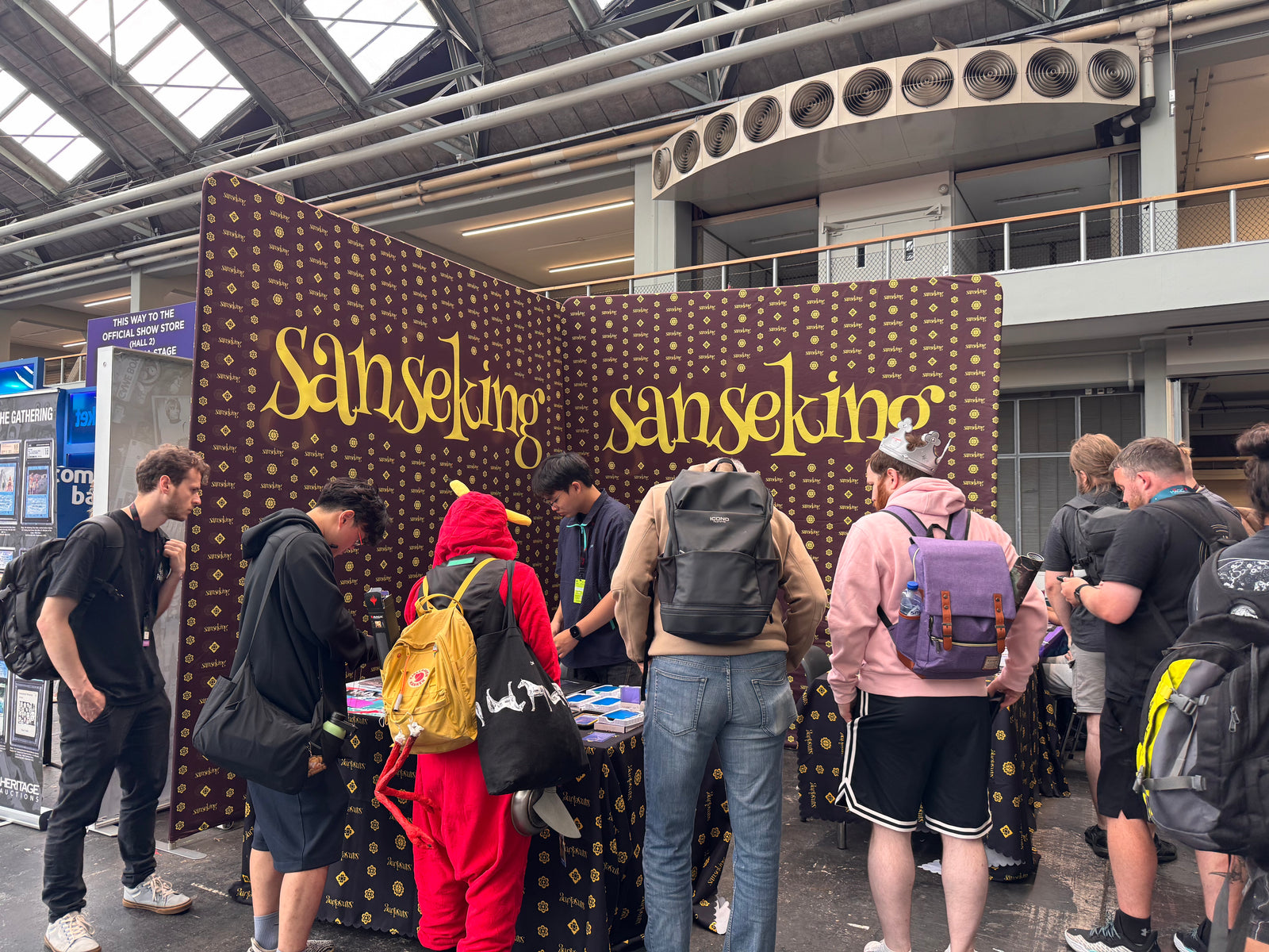 Customers visiting the Sanseking booth at a European card show